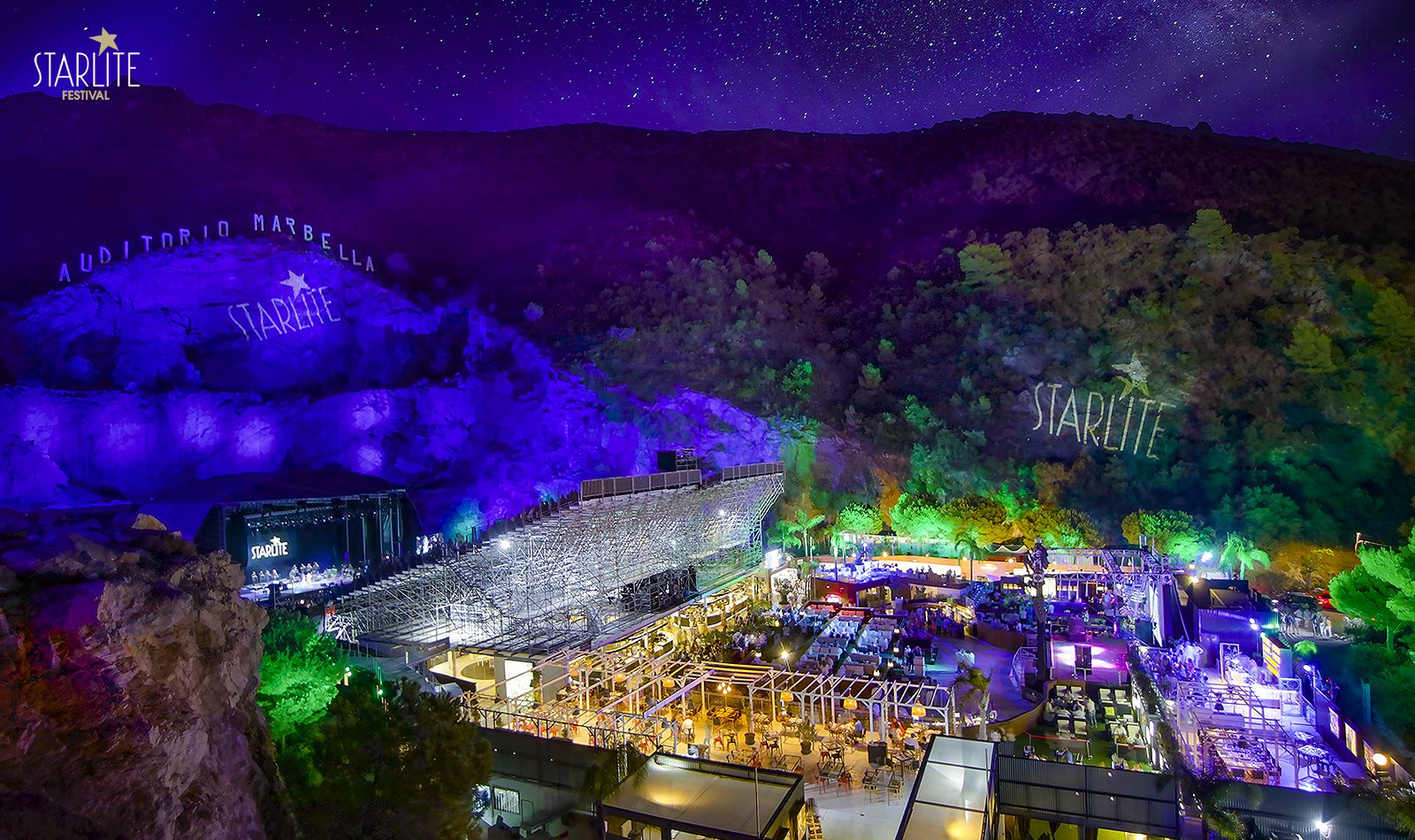 The Starlite stage lit up inside the quarry at night