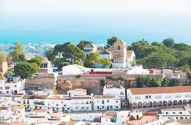 Mijas Pueblo's white houses above the coast